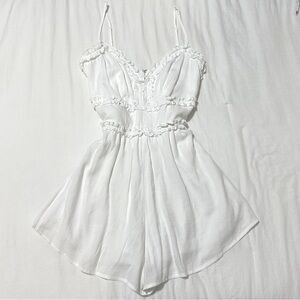 white romper with ruffle detailing